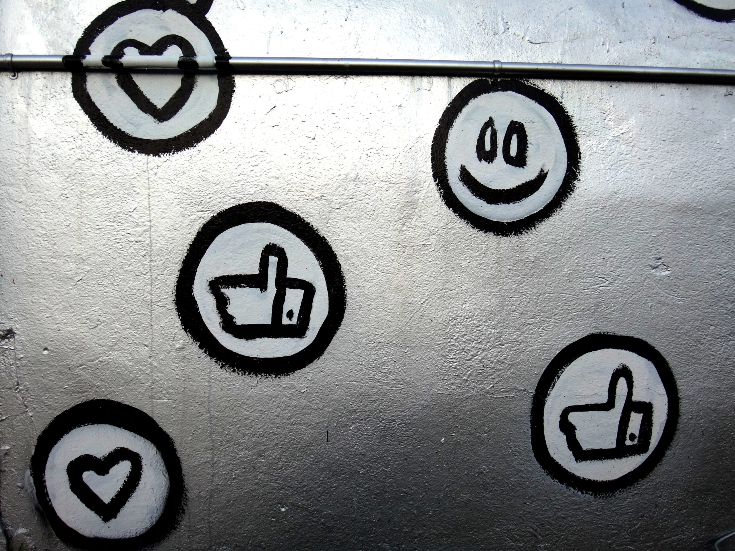hand painted smiley faces, hearts, and thumbs up