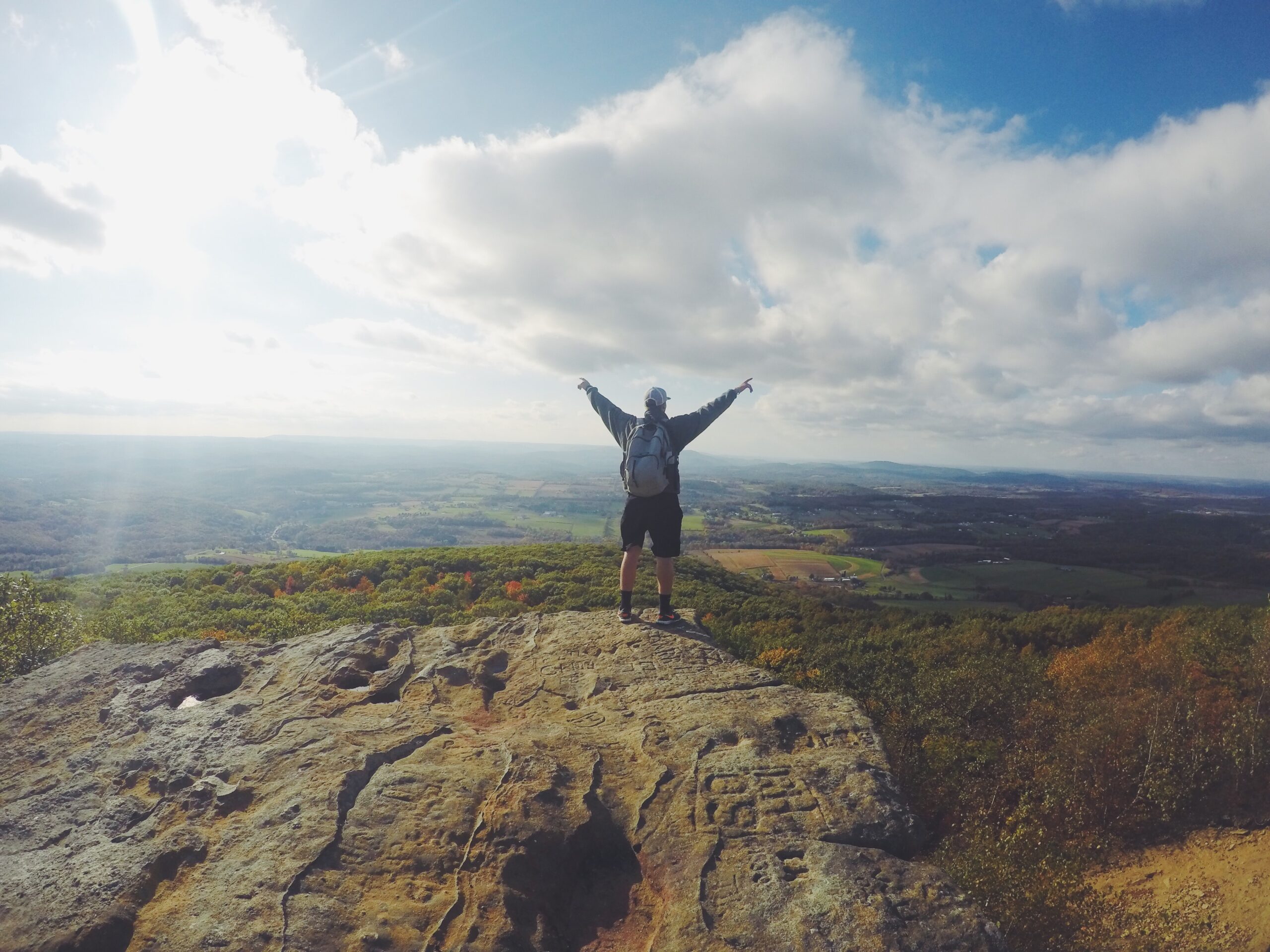 man on top of mountain