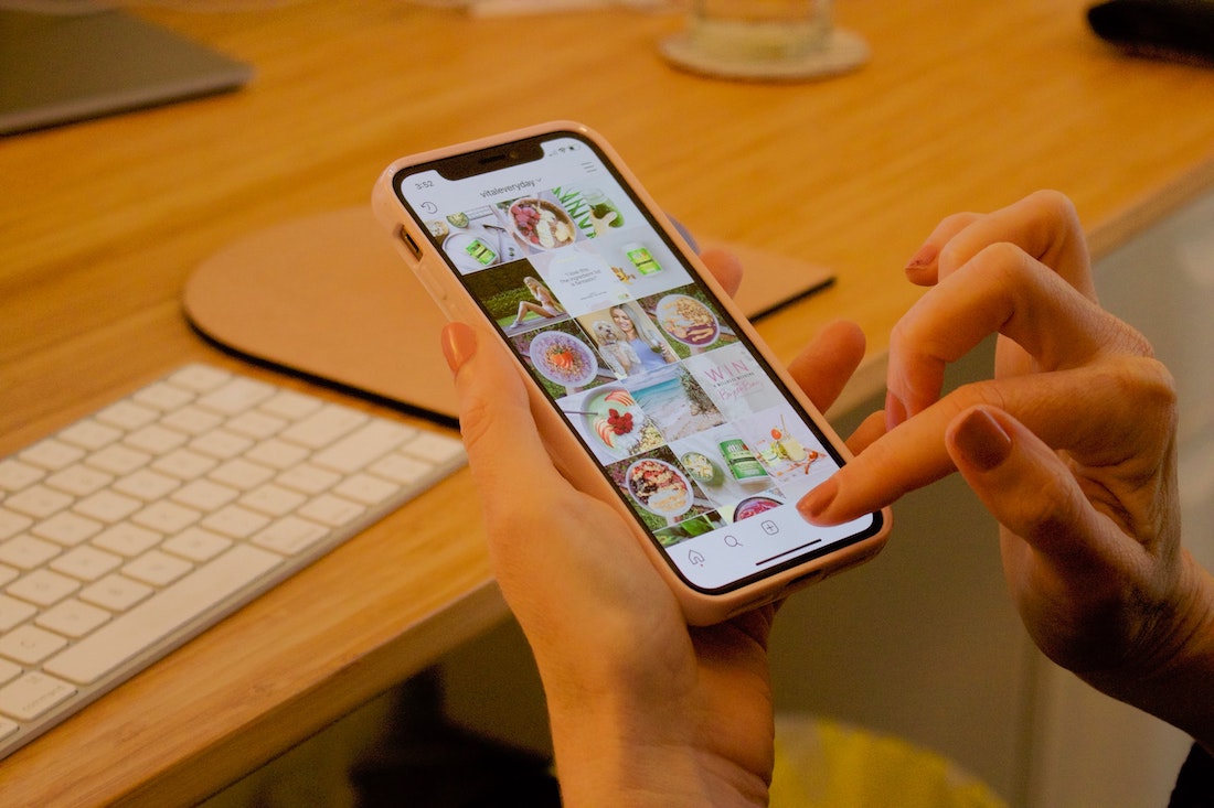 person scrolling through instagram photos