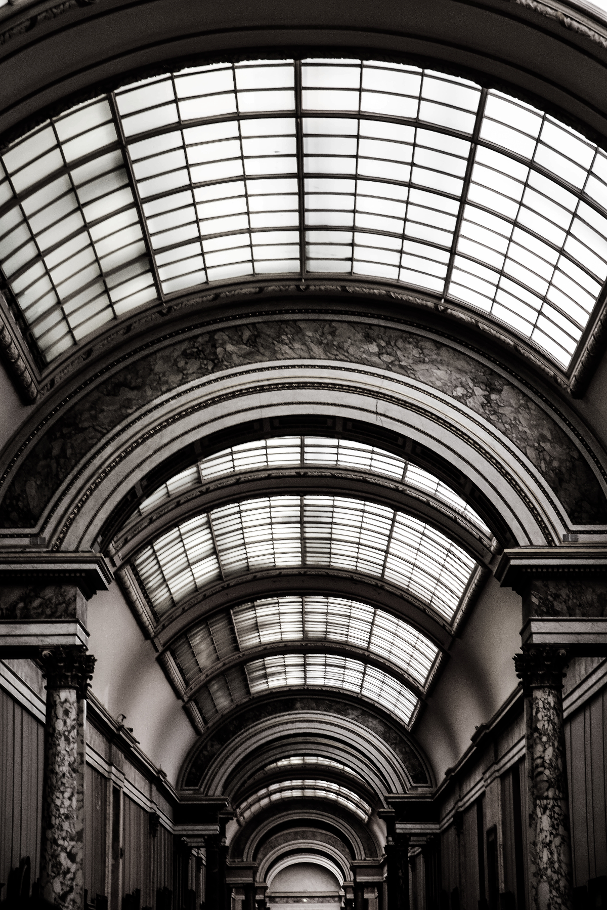 A beautiful arched ceiling with windows and columns