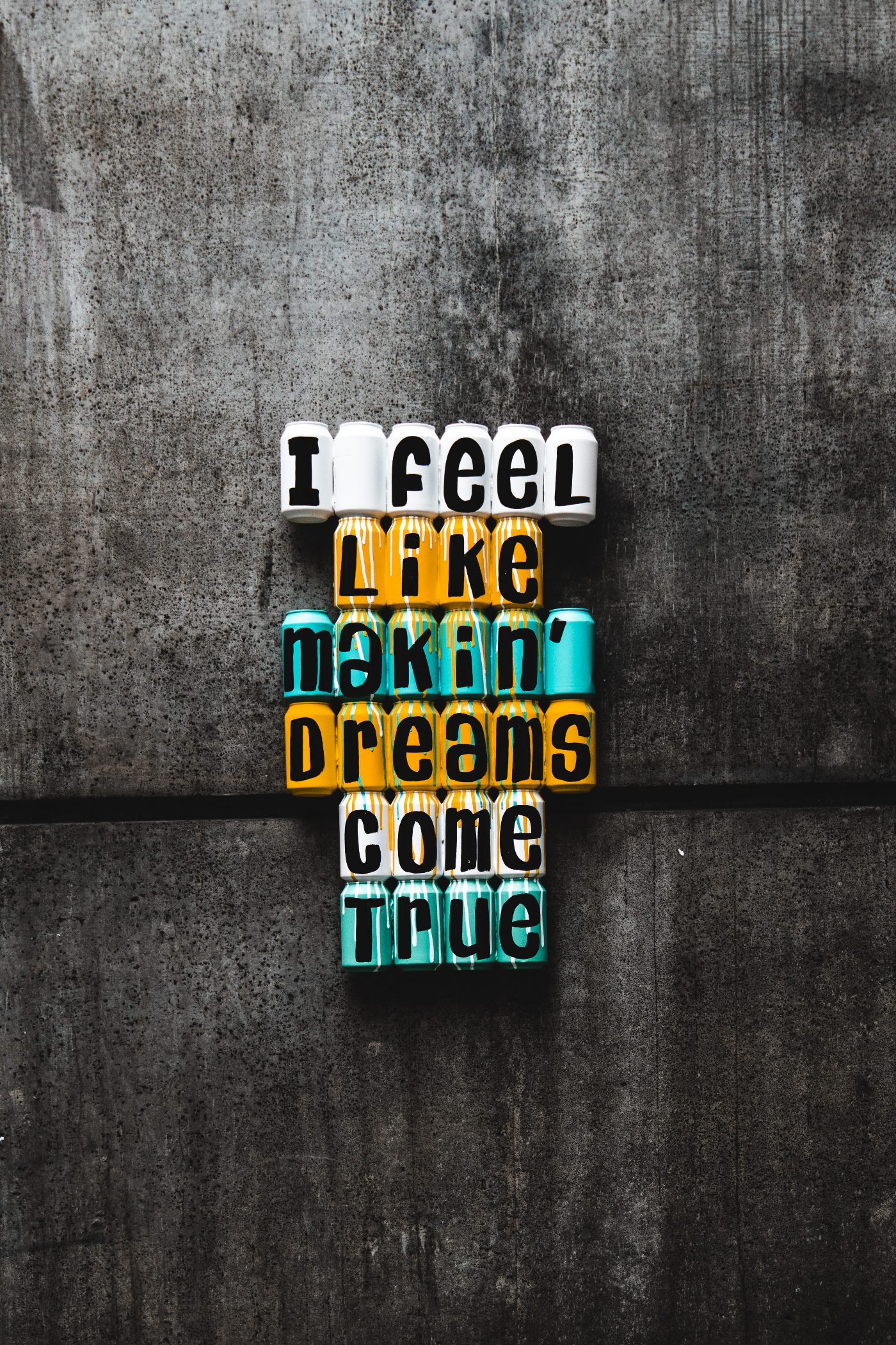 colorful words on a wall spelling out, I feel like makin' dreams come true.