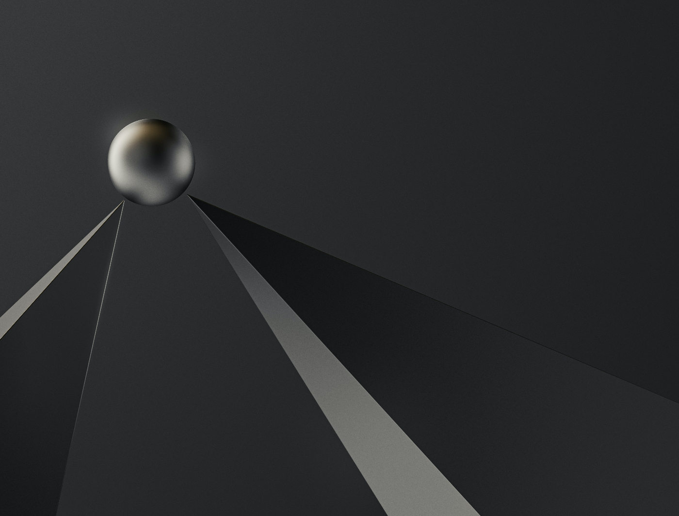 a steel ball sitting atop two steel spikes
