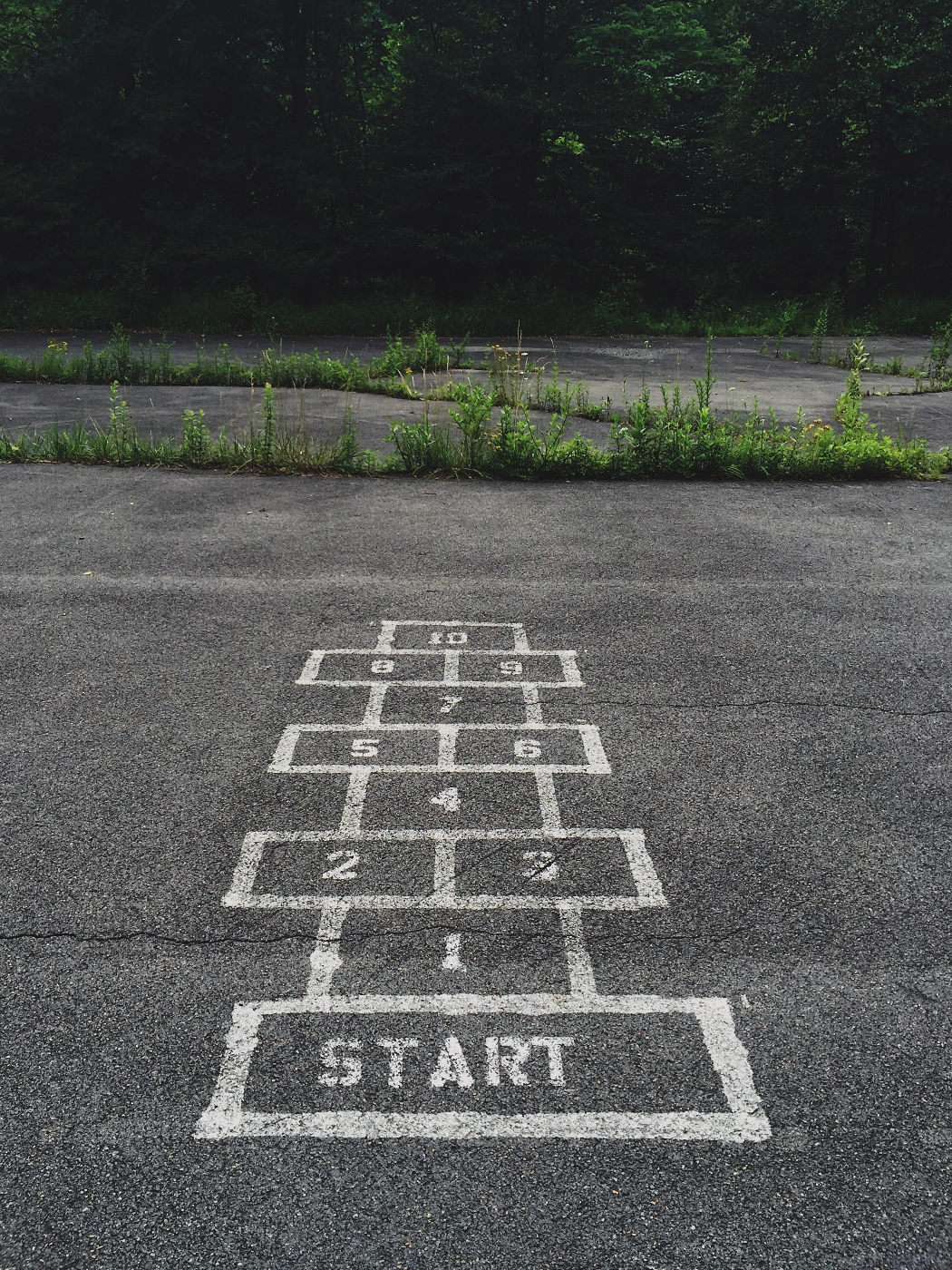 A hop scotch game on blacktop