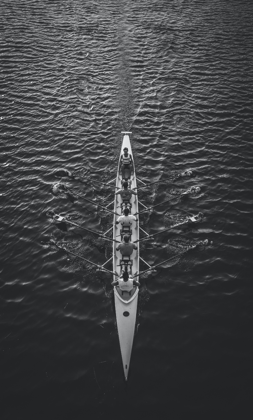 men in a skulling boat