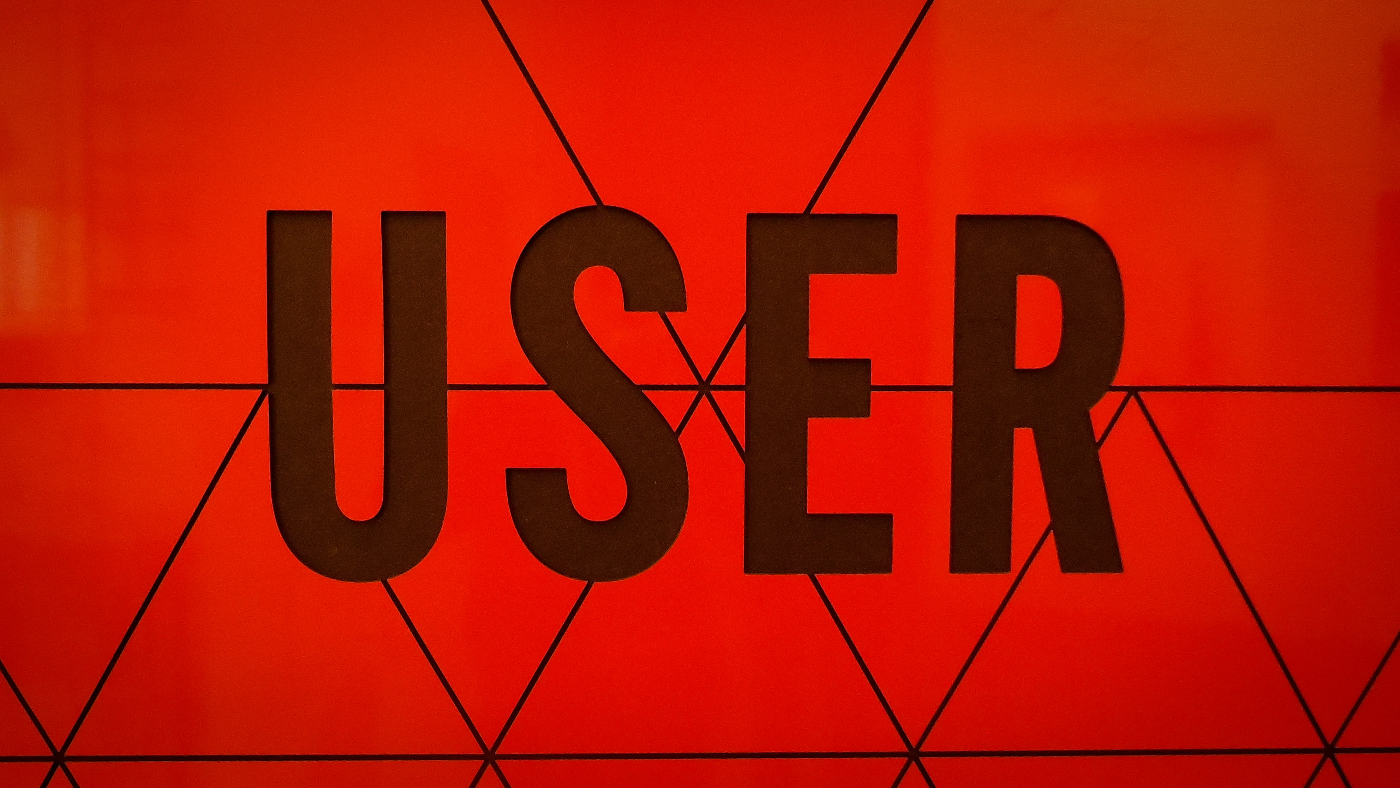 The word USER in black against a red background