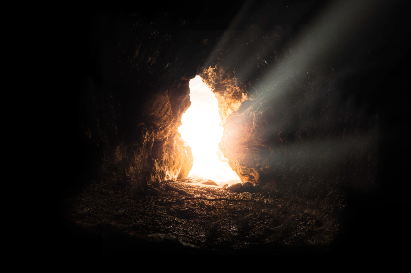 Sunlight streaming in at the mouth of a cave