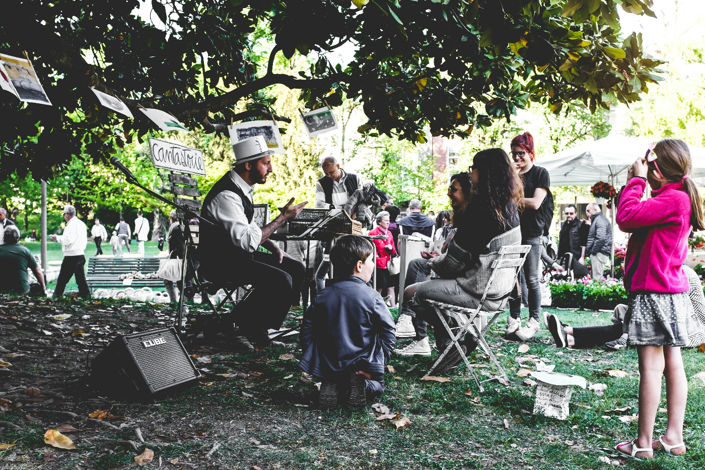 A storyteller speaking to a crowd