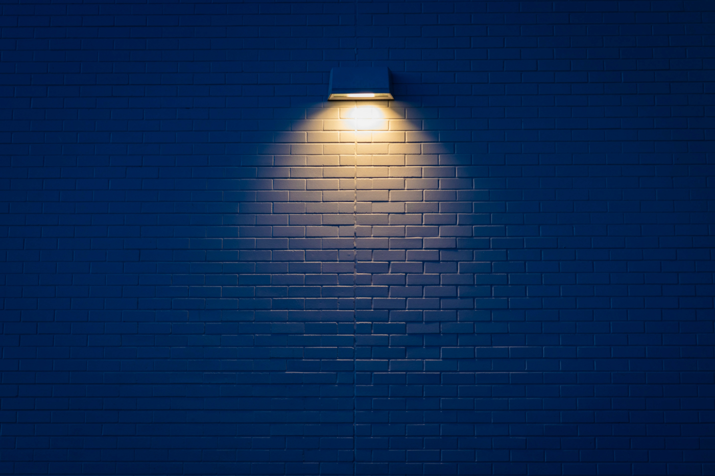 A down light on a brick wall