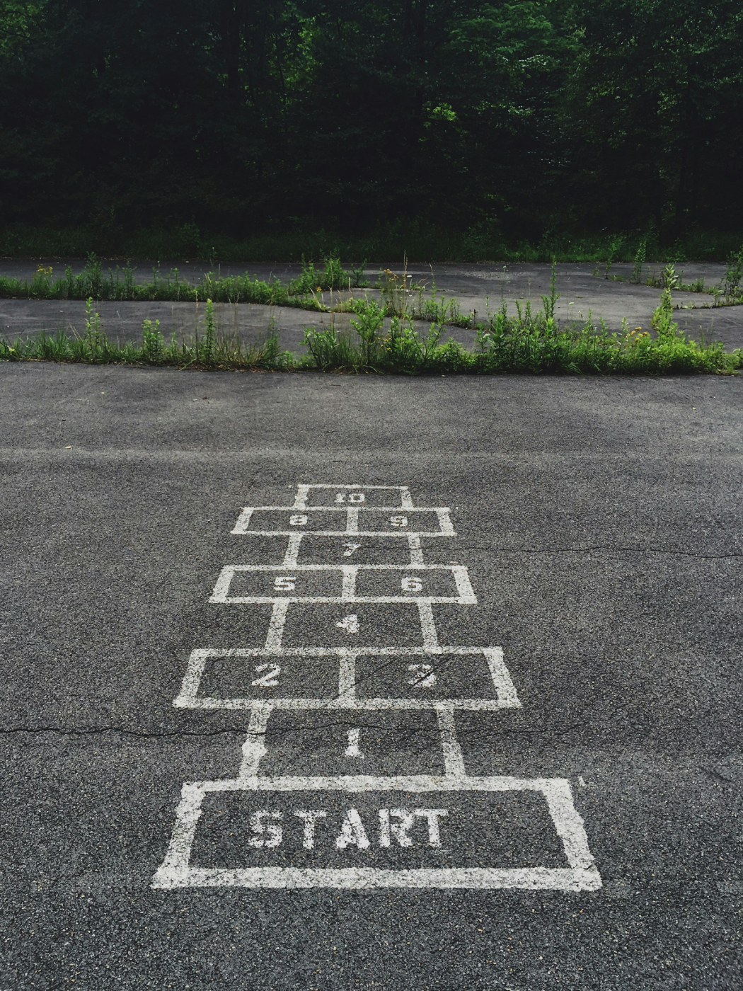A hopscotch board in a parking lot
