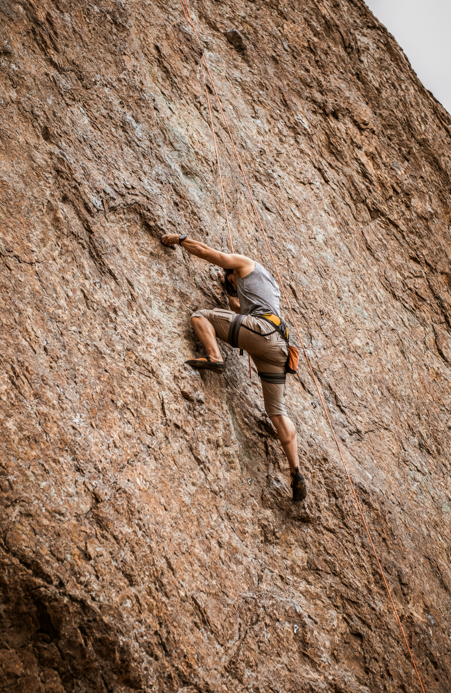 A man free climbing a rock face