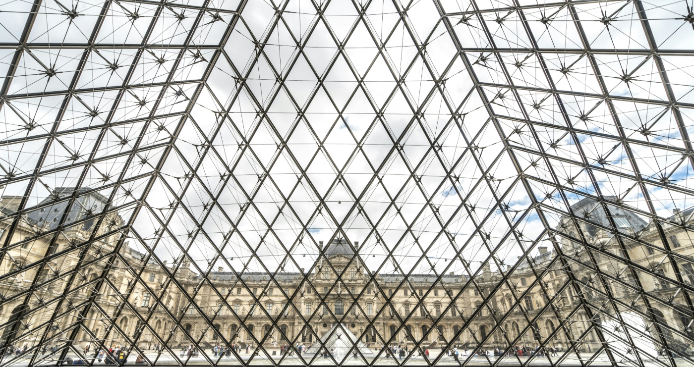 A view from inside the glass and metal pyramid entrance to the Louvre