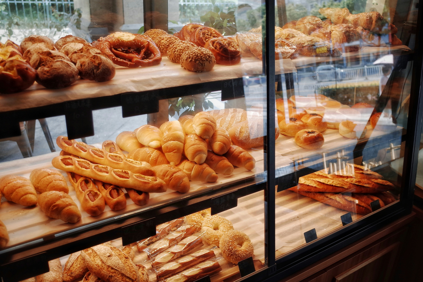 A bakery window with many treats