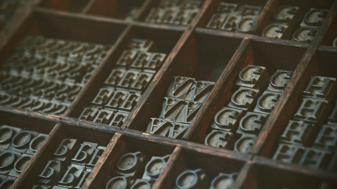 A printers letter box with letters (actions) in it