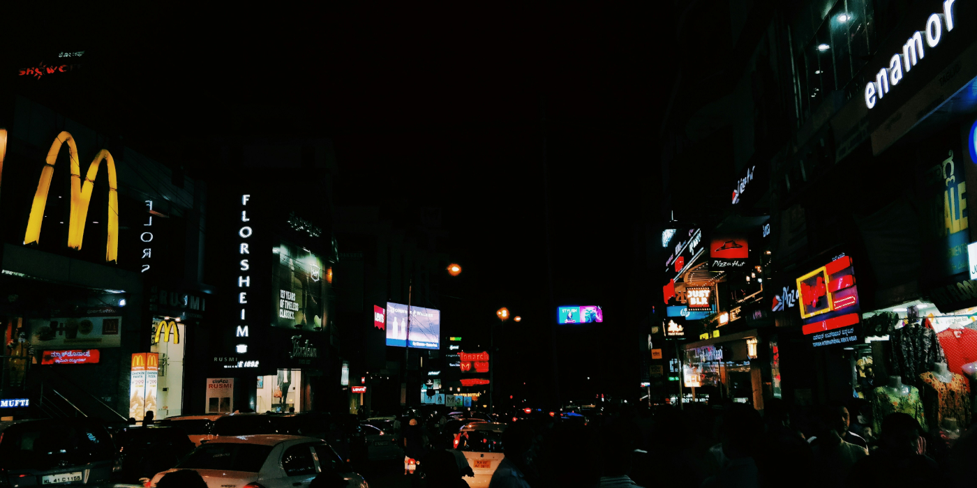 Times Square, night neon signs glowing brand names