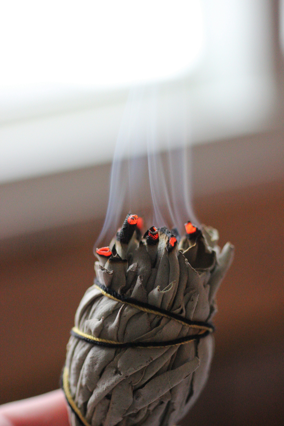 A burning sage stick