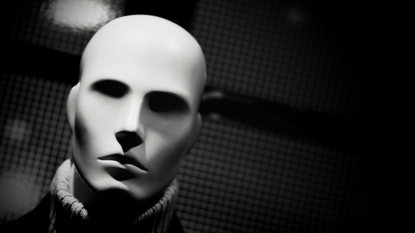 Gray scale of a mannequin wearing a turtle neck sweater