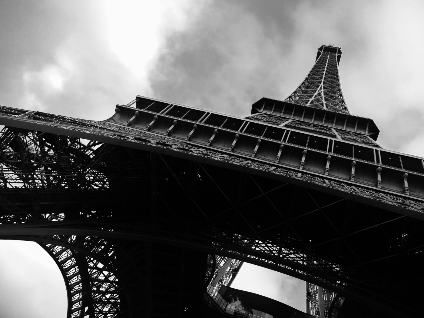 Black and white photo of the Eiffel Tower from the bottom up