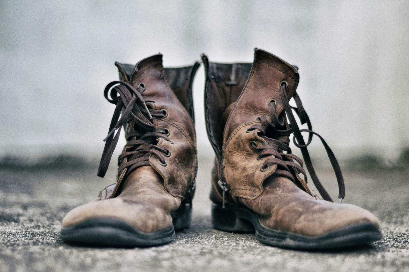 A pair of well worn leather boots