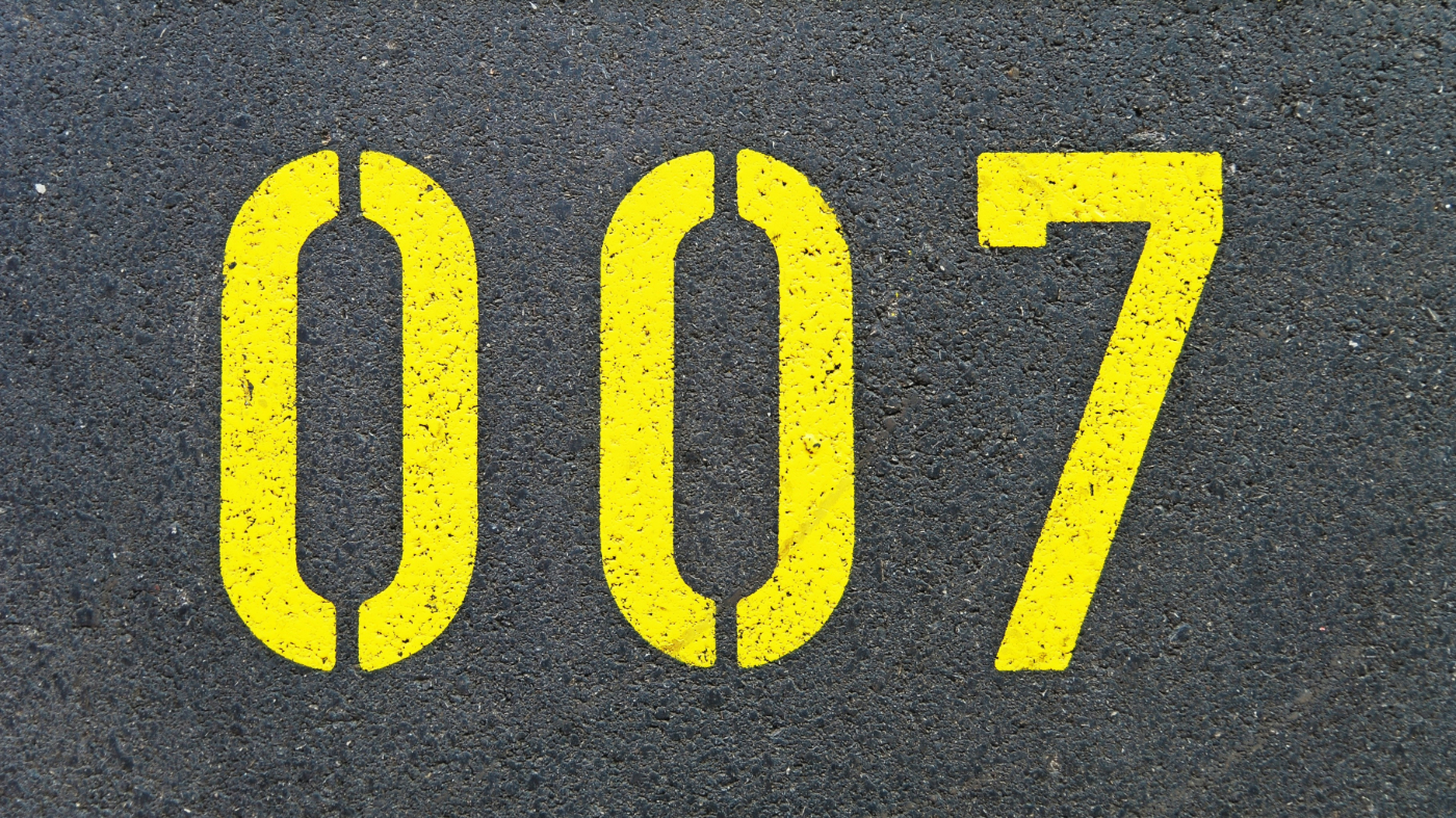 Double 0 7, painted in yellow block letters on a street
