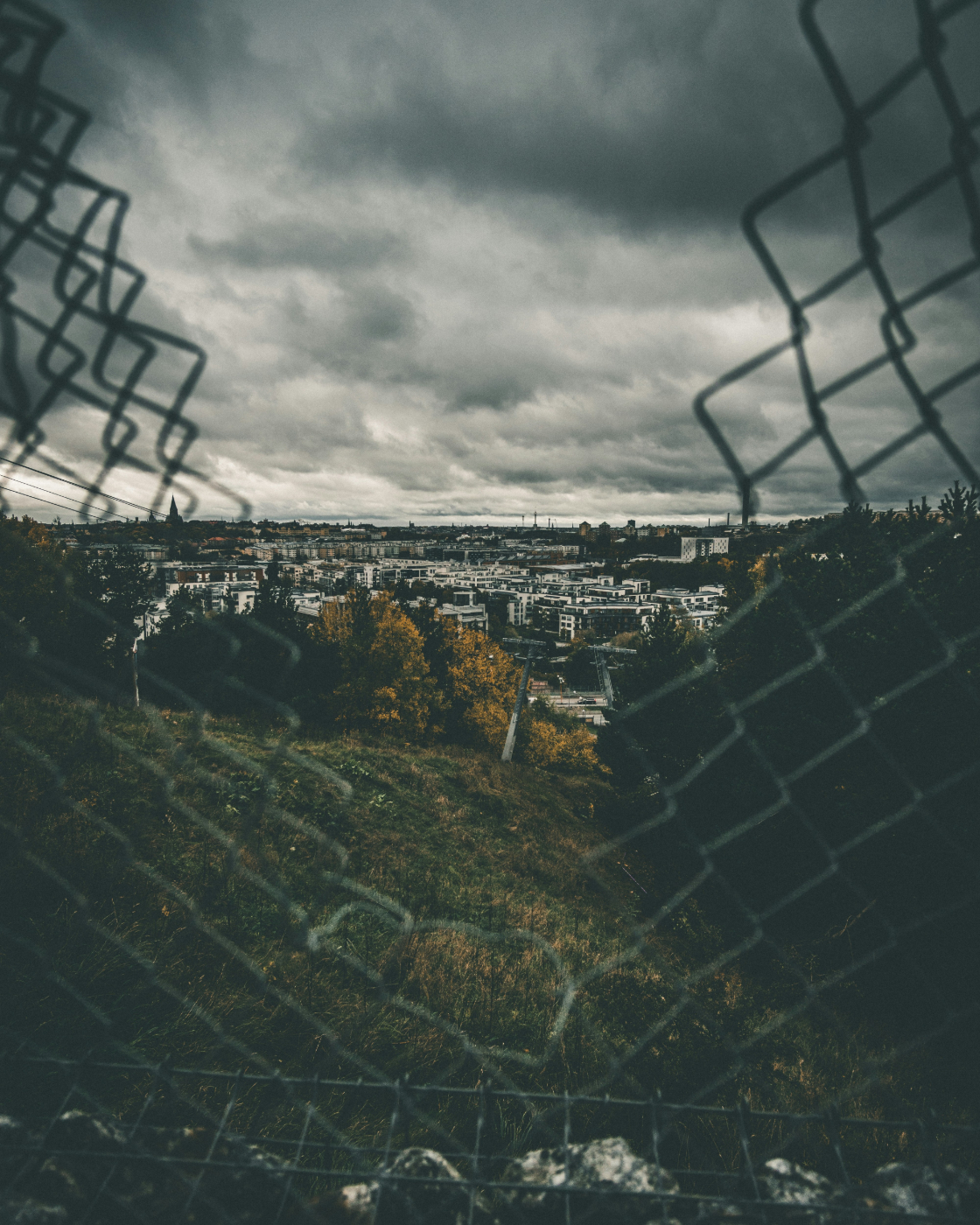 A view of Stockholm through a broken hurricane fence