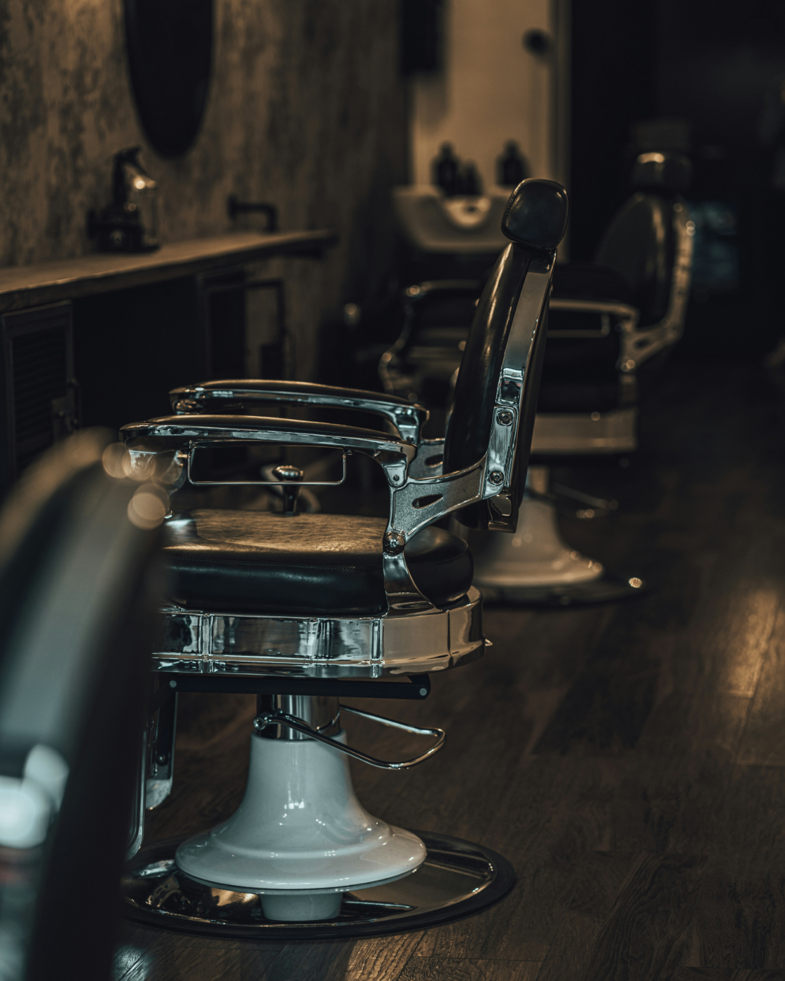 A black and silver classic barber chair