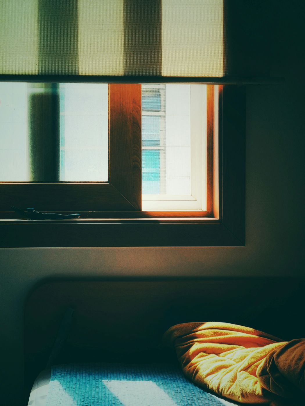 An open window over and bed