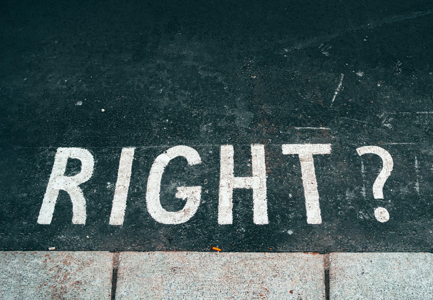 A street with RIGHT? stenciled on it