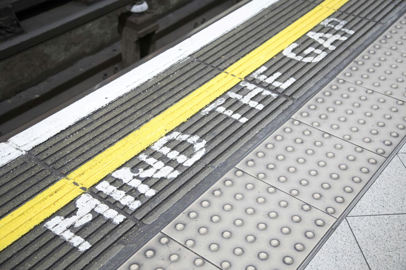 A mind the gap warning on a subway platform