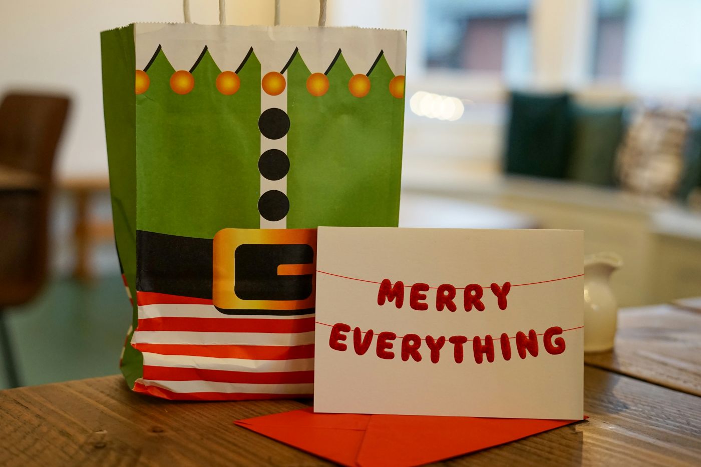 an elf bag and a card reading Merry everything