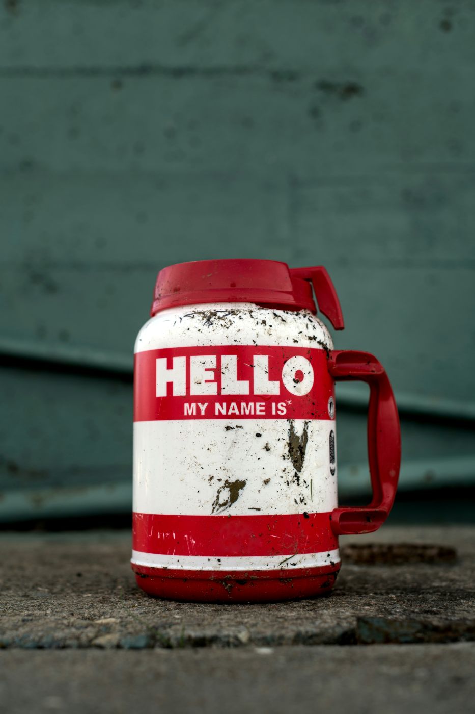 A large red and white travel tumbler with Hello! My Name Is ... on it