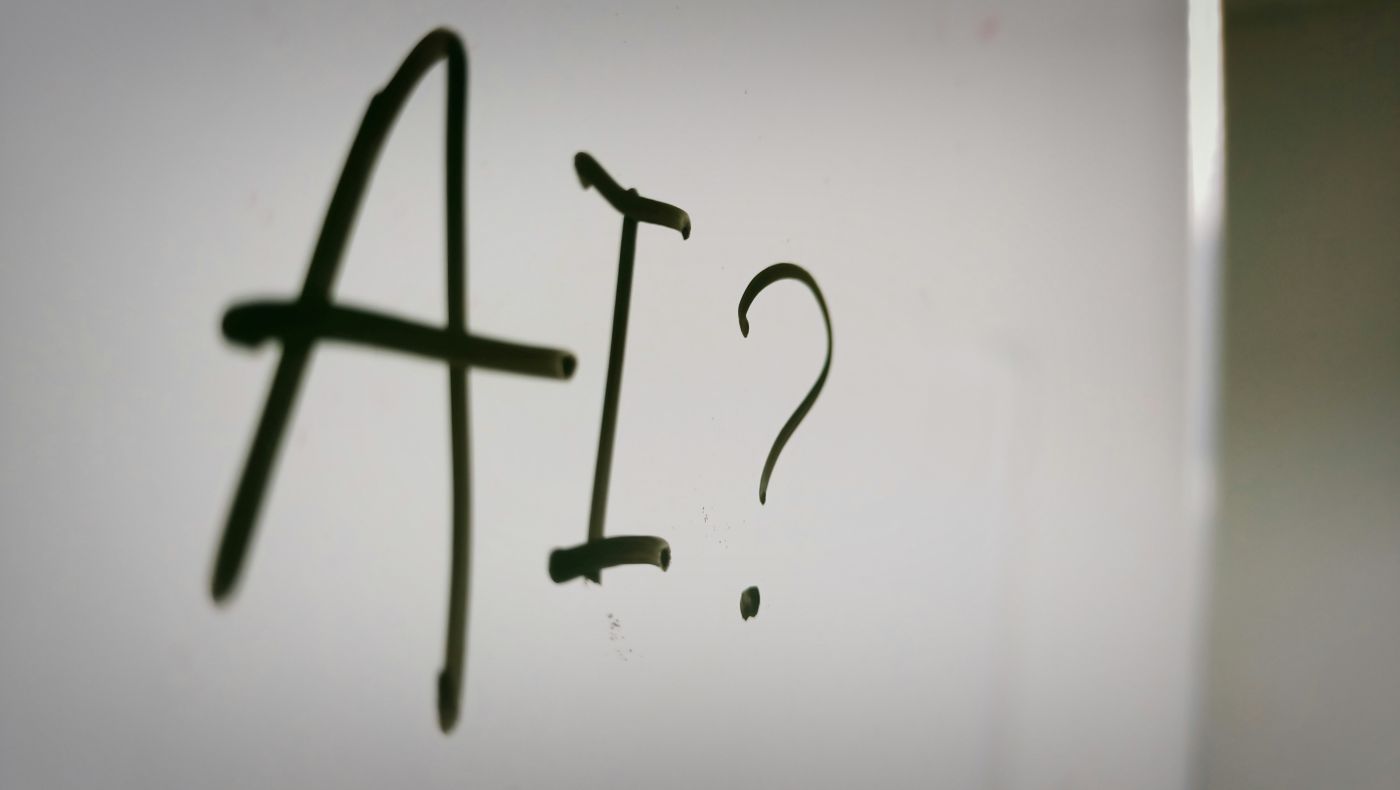 A white board with AI? written on it