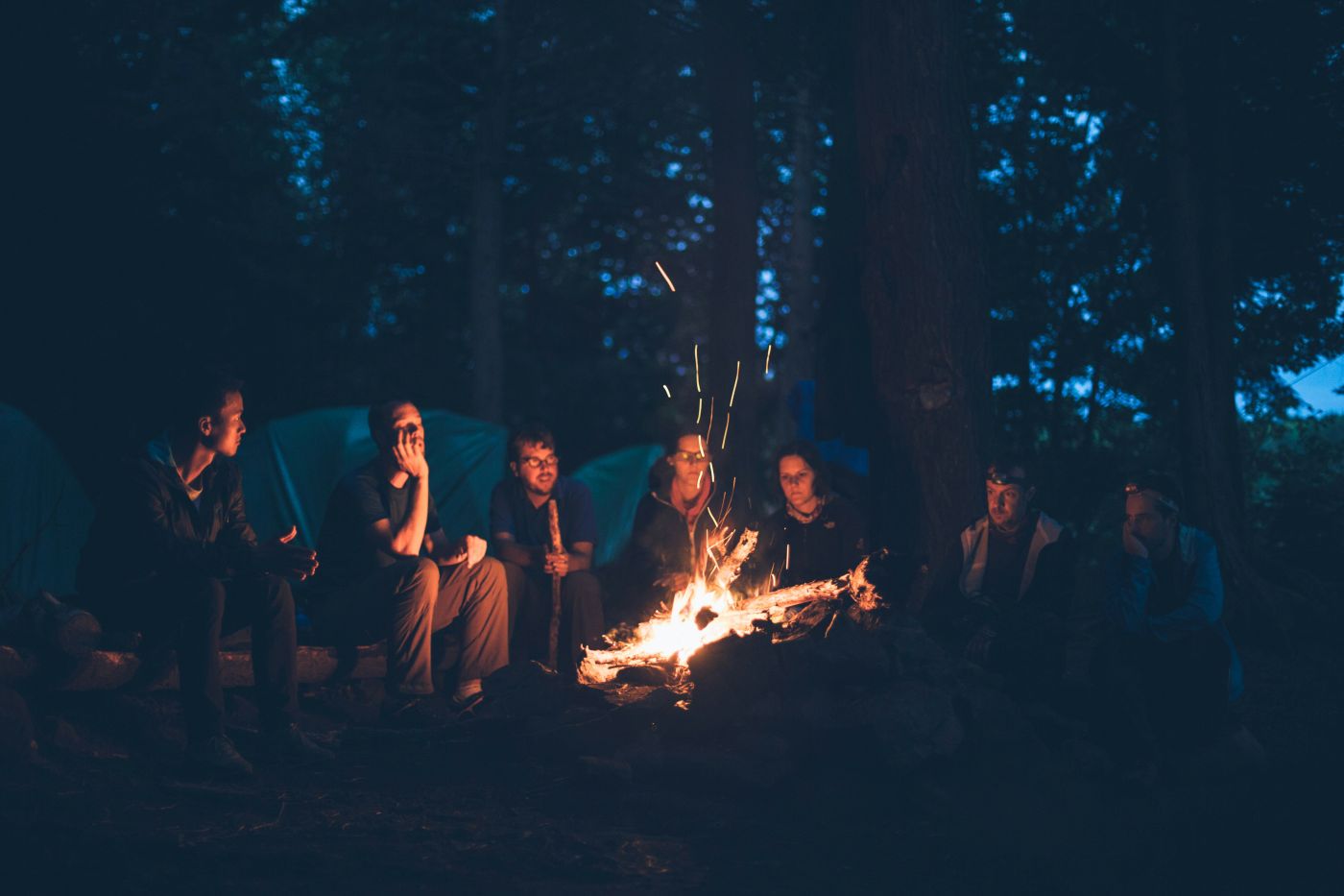 People sitting around a camp fire