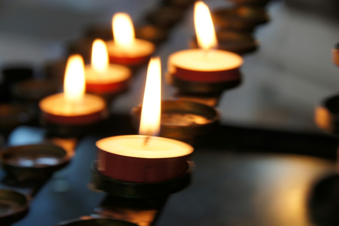 Lit candles in a church