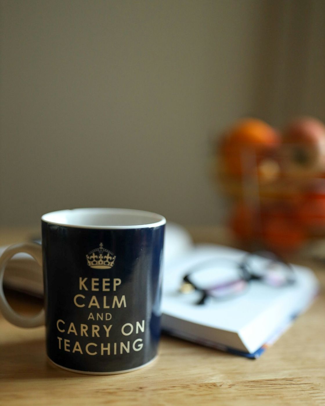 A coffee mug with Keep Calm and Carry On Teaching written on it.