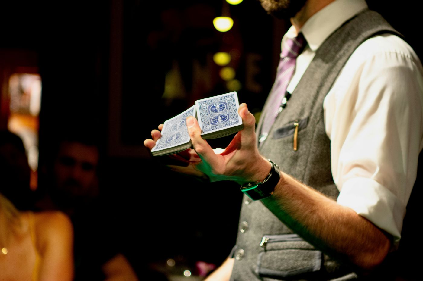 A magician doing a one hand shuffle