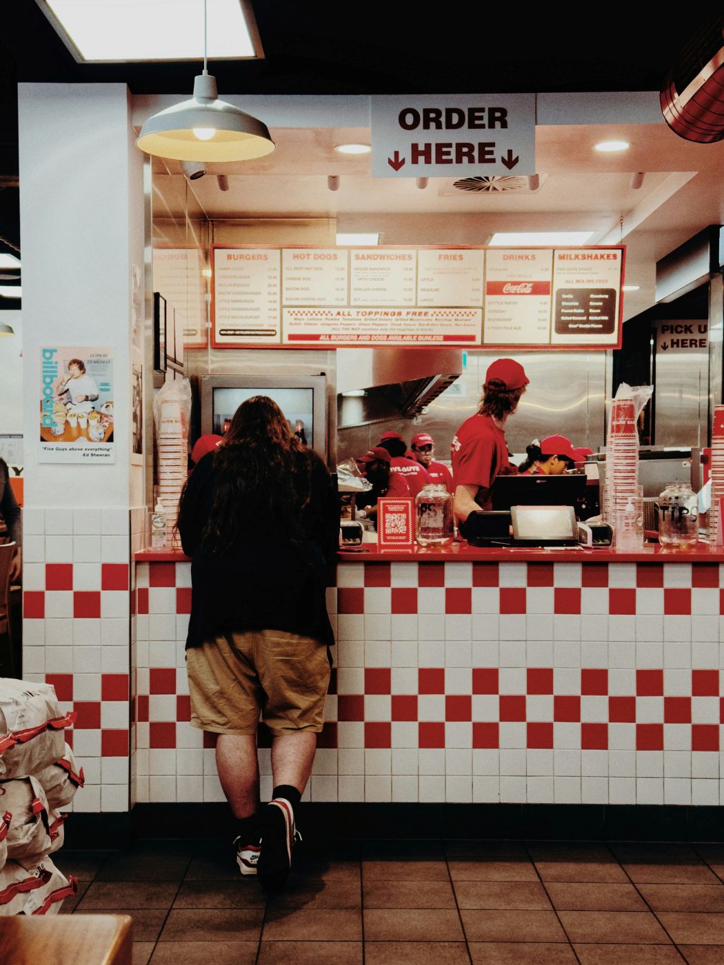 A man ordering at a fast food joint