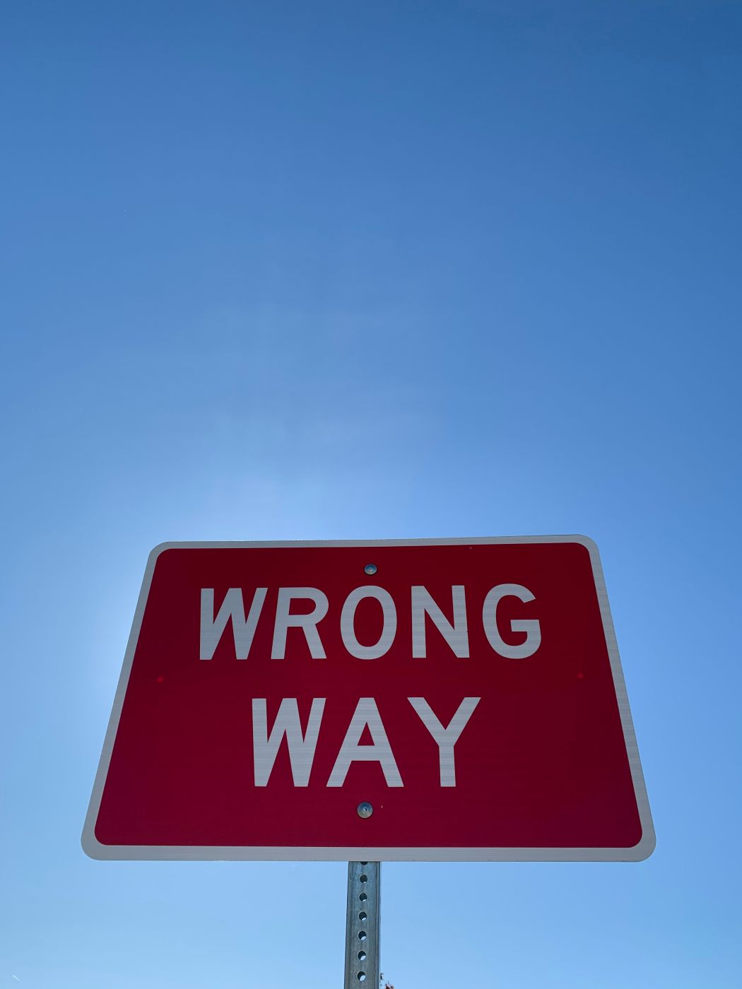 A red wrong way sign