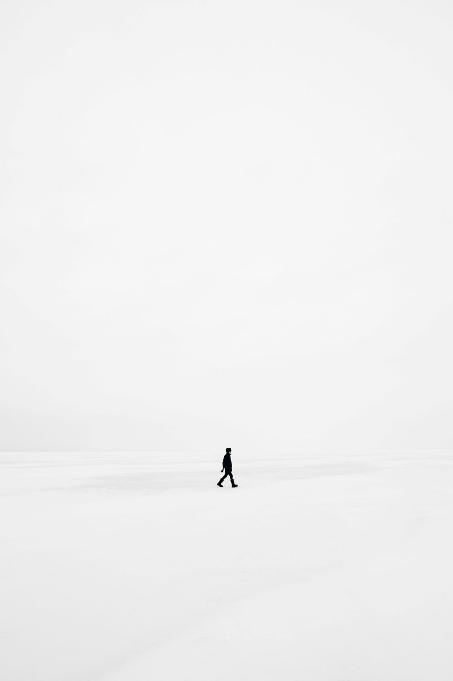 Person walking in a white background