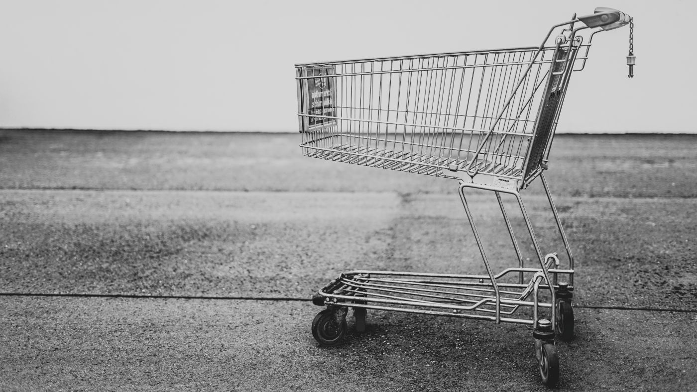 Black and white shot of a silver shopping cart
