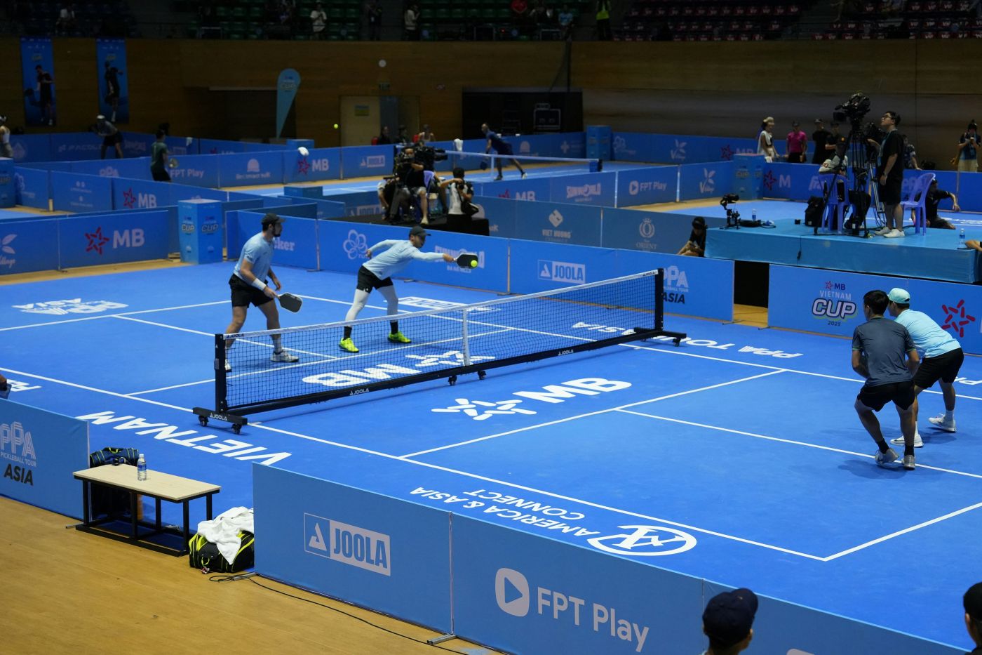 Mne on pickle ball courts that are covered in ads